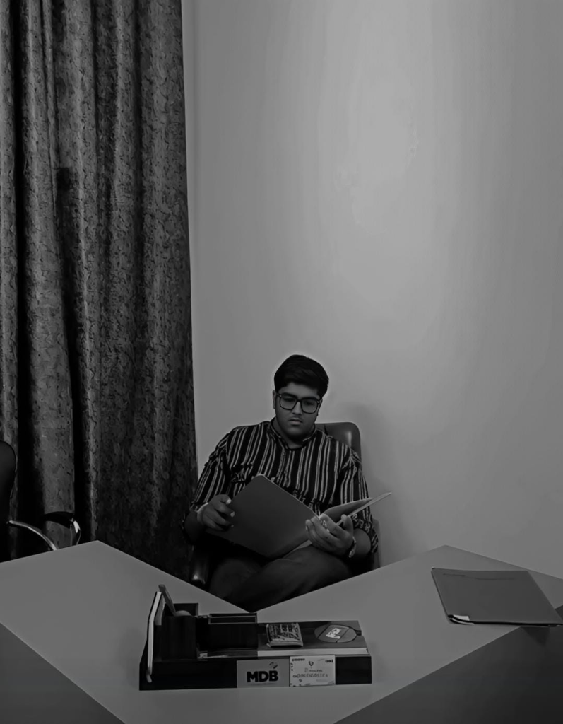 Velmora Properties Executive Professional at desk studying documentation